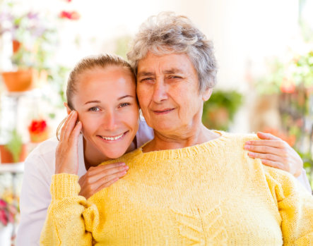 caregiver smiling each other