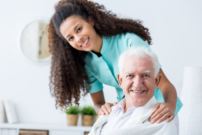 female caregiver with senior man